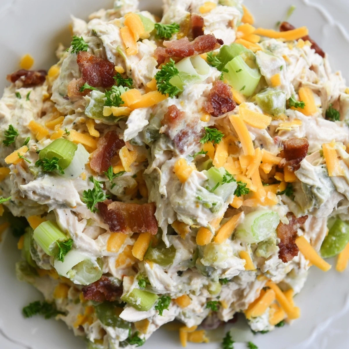 Served on crisp lettuce leaves, this zesty jalapeno popper cottage cheese chicken salad features diced peppers and shredded cheddar cheese