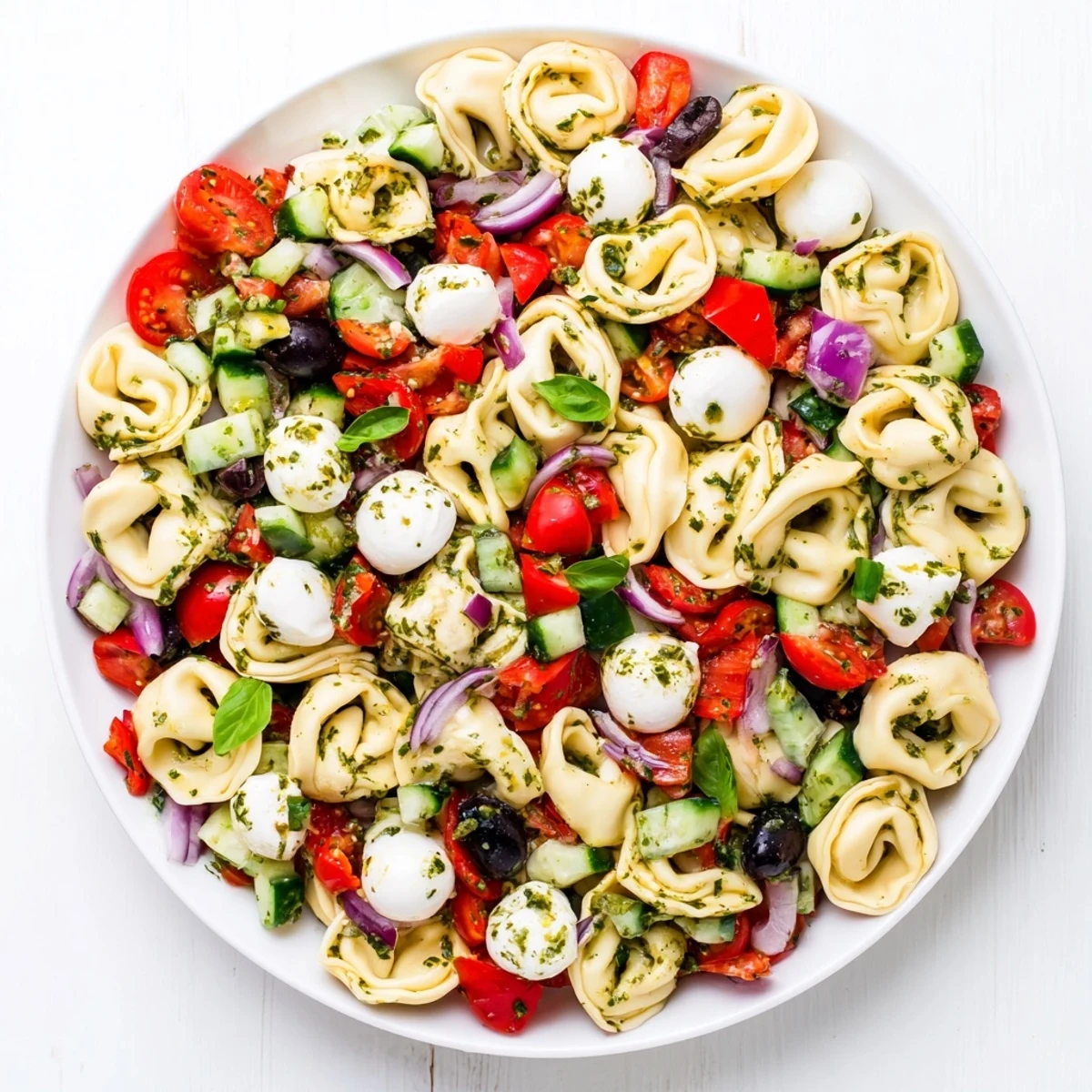 Creamy cheese tortellini tossed with crisp vegetables and herbs in Italian dressing