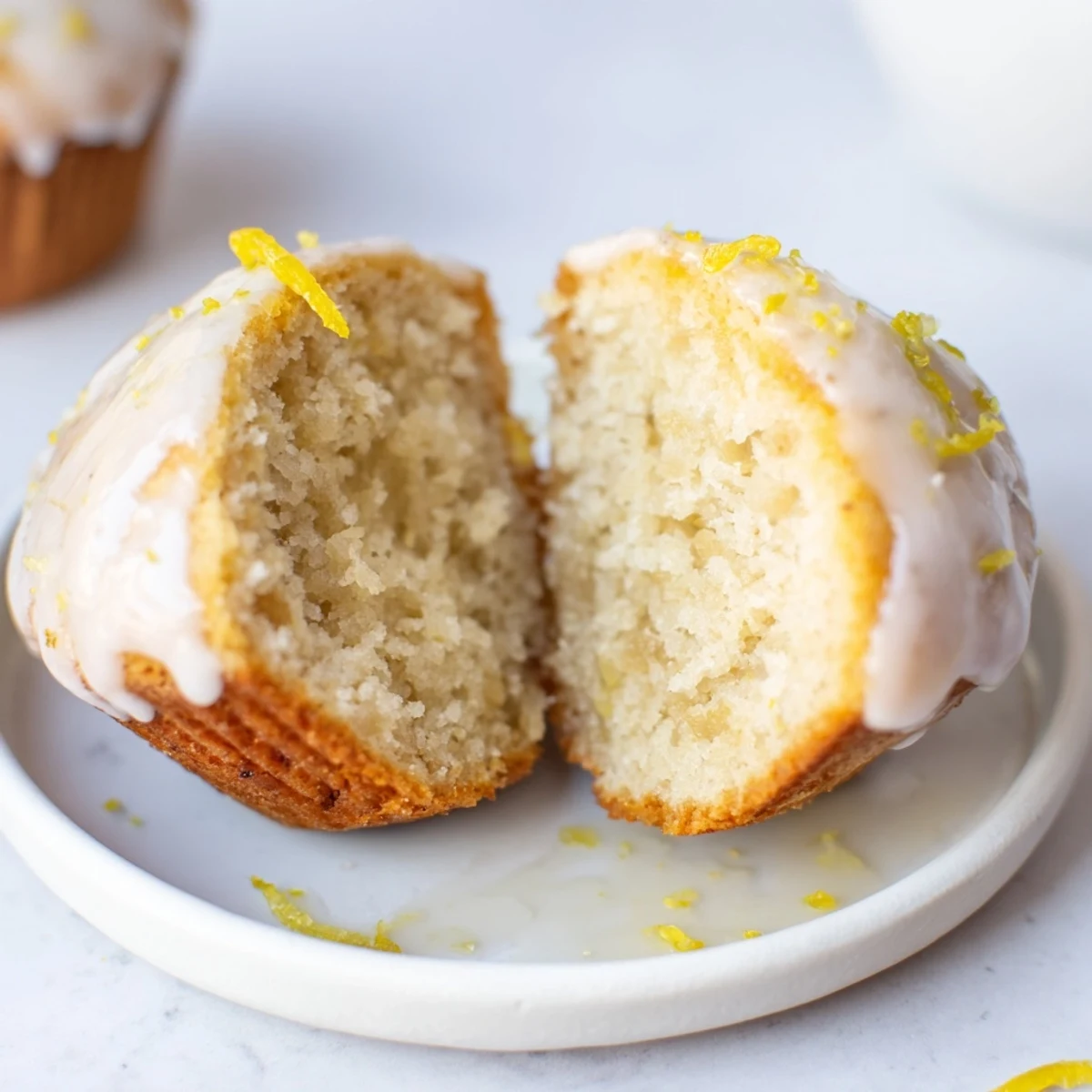 Glazed Lemon Ginger Muffins cooling on wire rack, tender gingery citrus bite