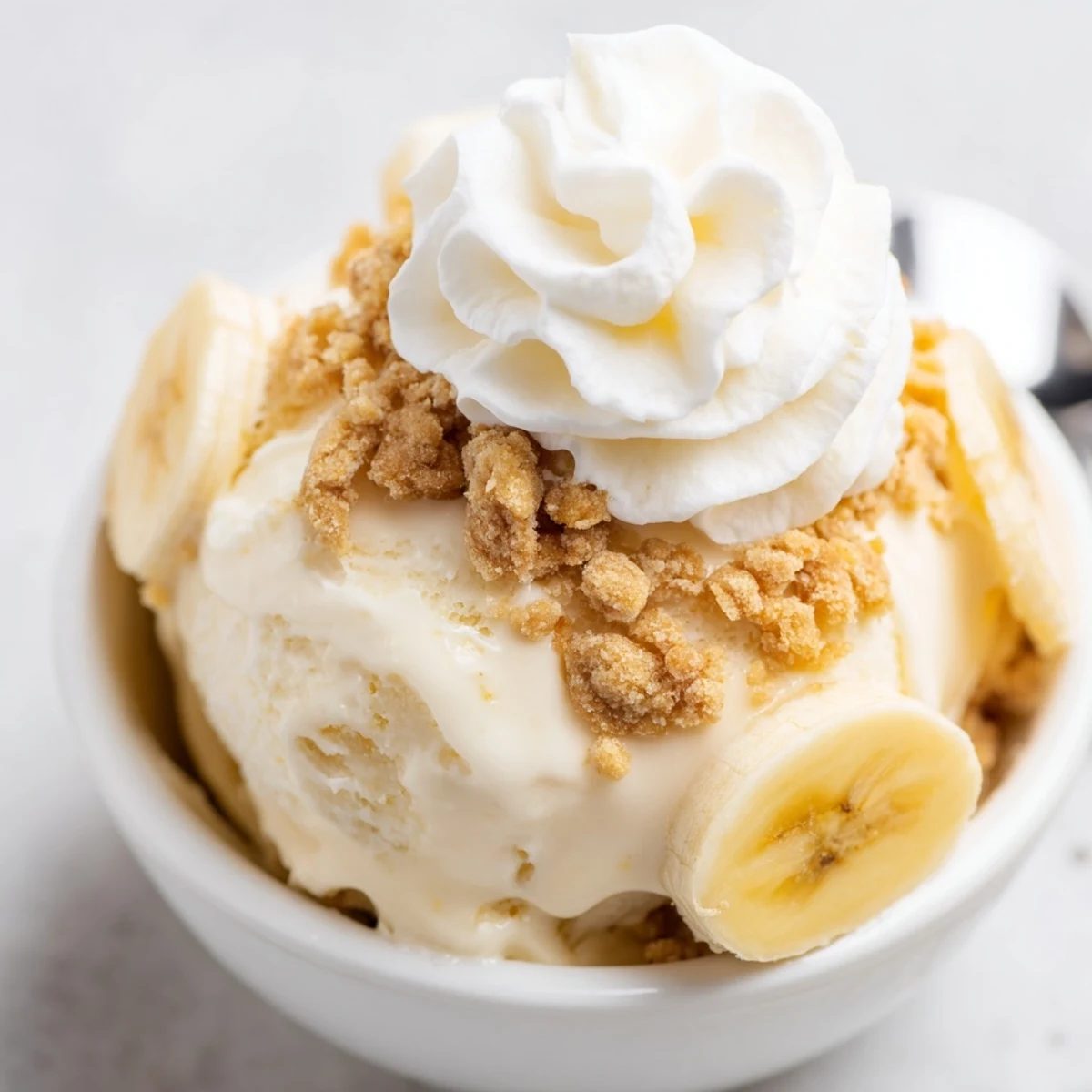 Cold Ninja Creami Banana Cream Pie Ice Cream topped with whipped cream