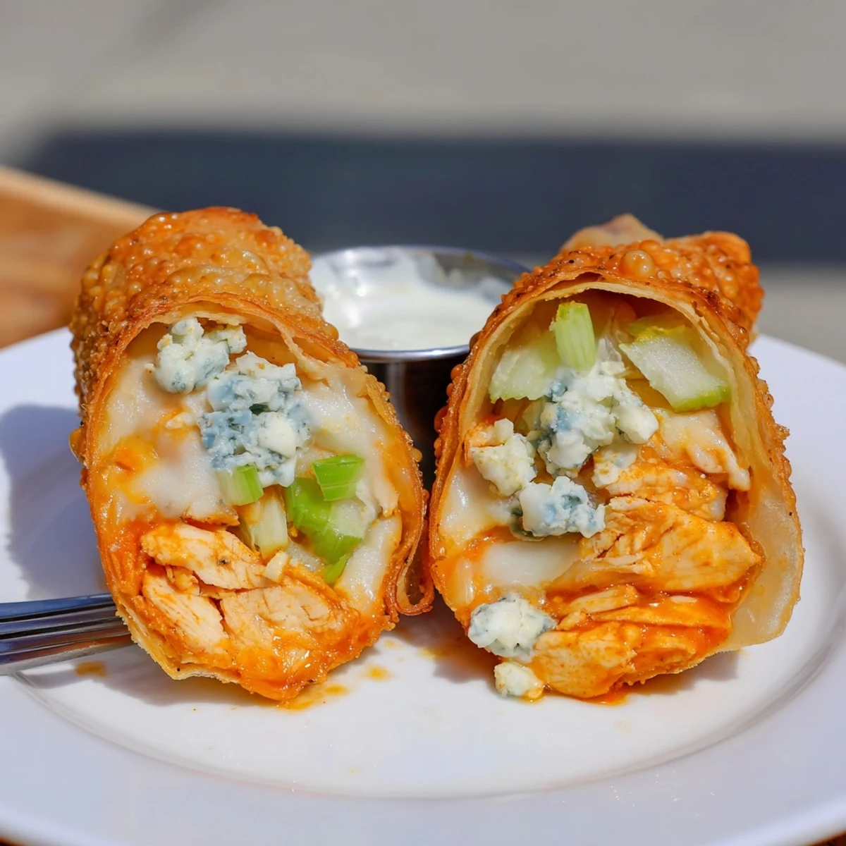 Warm Buffalo Chicken Egg Rolls served right from the hot fryer.