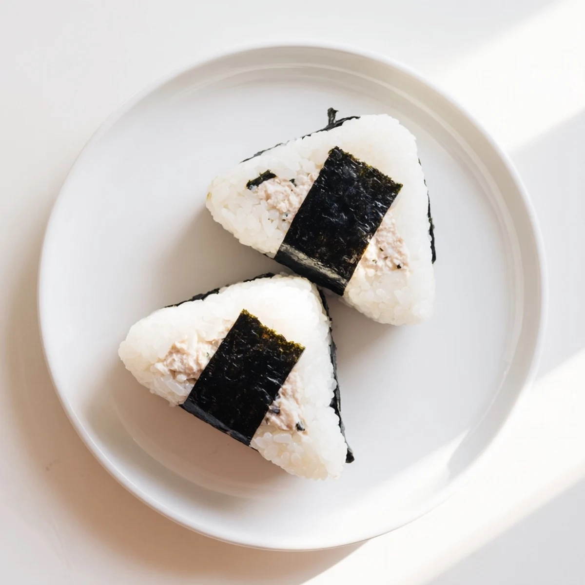 Creamy tuna mayonnaise filled Japanese rice ball garnished with black nori sheets
