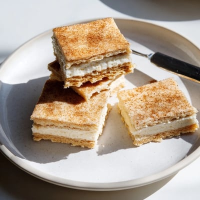 Crispy Churro Saltine White Toffee pieces drizzled in melted white chocolate